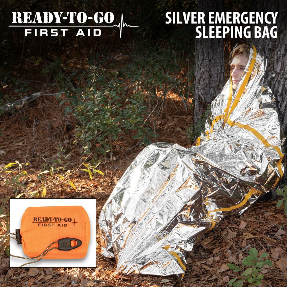 Full image of a person in the Ready-To-Go First Aid Silver Emergency Sleeping Bag. image number 0